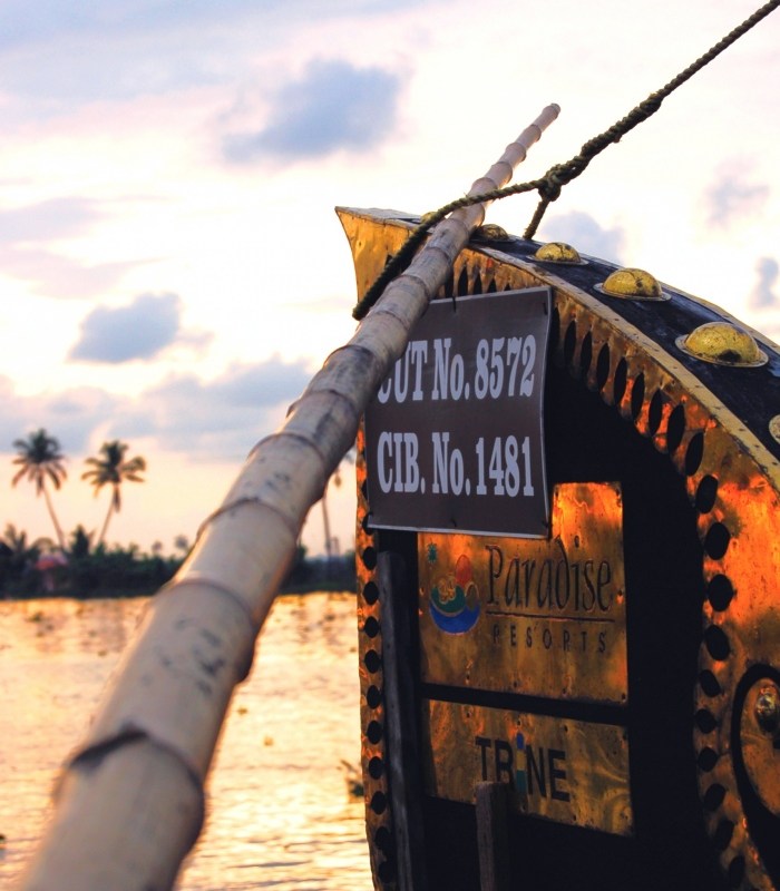 india houseboat on the canals of kerala. photo by guy bergstrom
